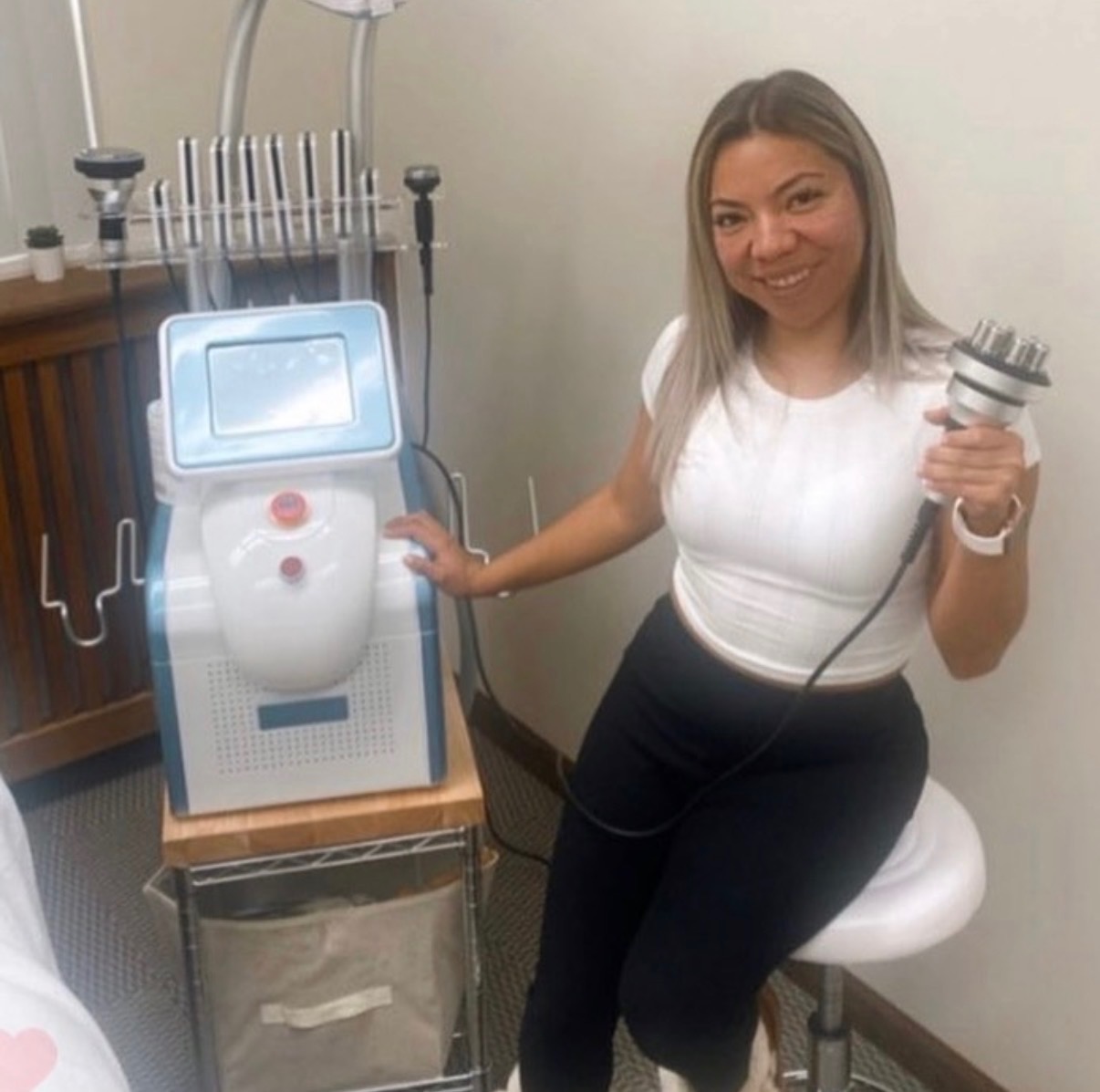 Jackie, founder of Bodi Bodega, with her body sculpting equipment